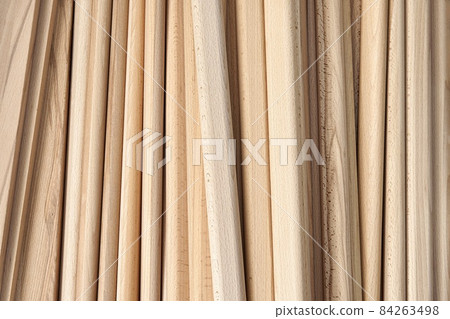 Wooden bars of solid beechwood in carpentry workshop 84263498