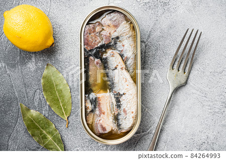 Sardines can preserve, on gray stone table background, top view flat lay 84264993