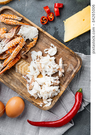 Chilli crab silky omlette ingredients, on gray background, top view flat lay Chilli crab silky omlette ingredients, on gray background, top view flat lay 84265006