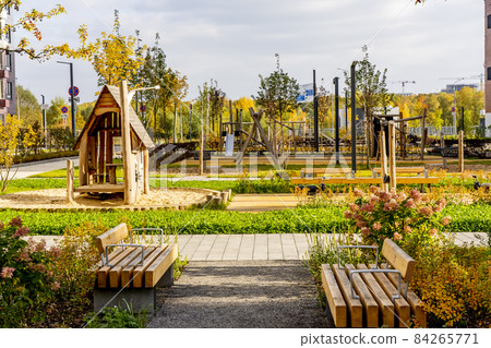 Beautiful multi colorful building of new modern residential area for young families. Playground in public yard. Residential district with bright facade geometry Beautiful multi colorful building of new modern residential area for young families. Playground in public yard. Residential district with bright facade geometry 84265771