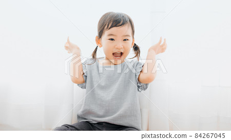 Girl playing hide and sees 84267045