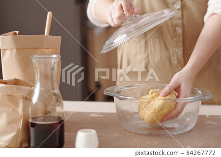 Woman Letting Dough to Relax Woman Letting Dough to Relax 84267772