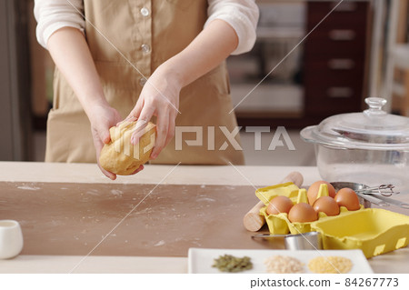 Woman Kneading Dough Woman Kneading Dough 84267773