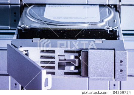 detail of hard disk in a tray that is being installed inside dat 84269734
