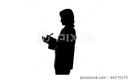 Photo of woman's silhouette takes notes on isolated white background 84270275