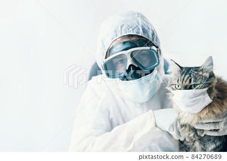 Man in suit and cat in a medical mask Man in suit and cat in a medical mask 84270689