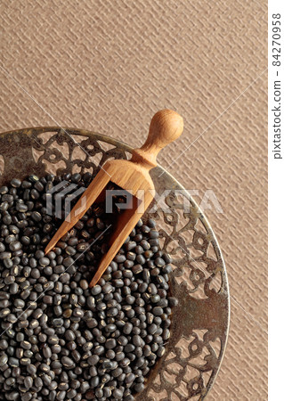 Raw uncooked black lentils (lens culinaris). Raw uncooked black lentils (lens culinaris). 84270958