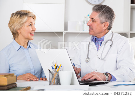 Mature woman visits doctor 84271282