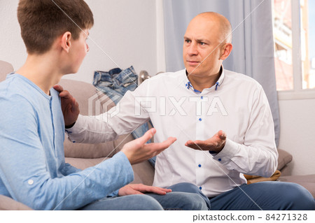 Father talking to son Father talking to son 84271328