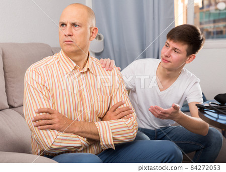 Unhappy man turned away from his son 84272053