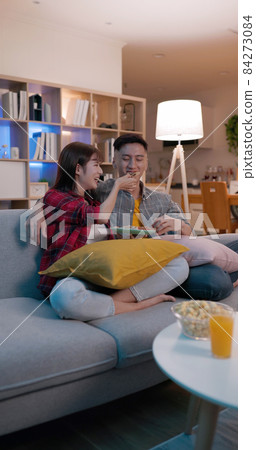 couple watch tv at home couple watch tv at home 84273084