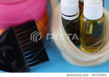 Bottles with cosmetics for hair care and brush to dye hair Bottles with cosmetics for hair care and brush to dye hair 84274409