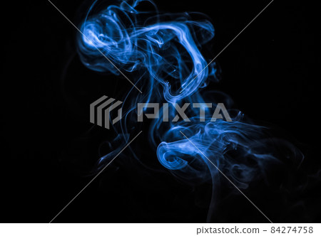 Beautiful blue smoke on a black background. Trend color of the year Beautiful blue smoke on a black background. Trend color of the year 84274758