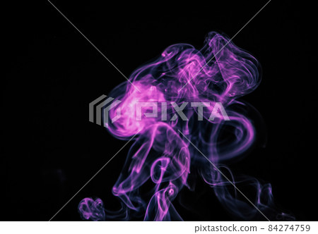 Unusual purple smoke on a black background. Unusual purple smoke on a black background. 84274759
