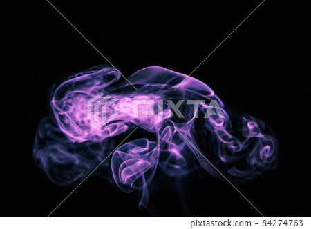 Unusual purple smoke on a black background. Unusual purple smoke on a black background. 84274763
