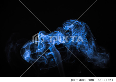 Beautiful blue smoke on a black background. Trend color of the year 84274764