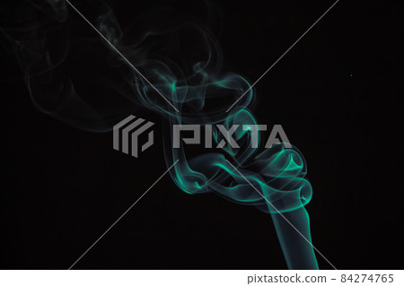 Green puffs of smoke on a black background. Green puffs of smoke on a black background. 84274765
