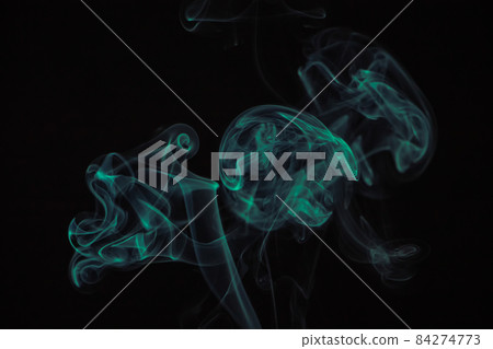 Green puffs of smoke on a black background. Green puffs of smoke on a black background. 84274773