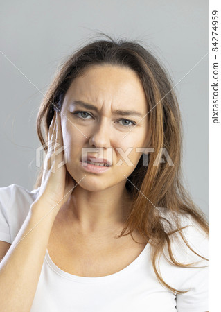 Young woman with ear pain 84274959