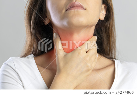 Woman with throat ache. Woman touching her throat 84274966
