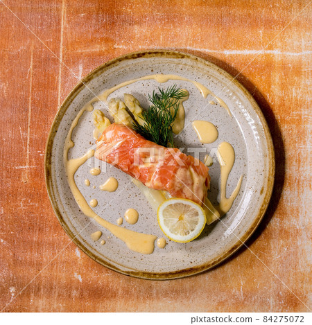 Cooked salmon fish on homemade ceramic plate Cooked salmon fish on homemade ceramic plate 84275072