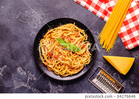 Homemade pasta with pancetta, egg, hard parmesan cheese and cream sauce 84276646