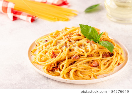 Homemade pasta with pancetta, egg, hard parmesan cheese and cream sauce Homemade pasta with pancetta, egg, hard parmesan cheese and cream sauce 84276649