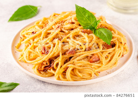 Homemade pasta with pancetta, egg, hard parmesan cheese and cream sauce Homemade pasta with pancetta, egg, hard parmesan cheese and cream sauce 84276651