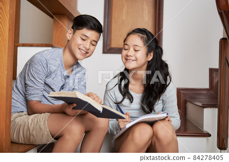 Boy Explaining Topic to Sister 84278405