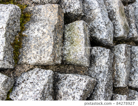Detail of a stepped stone wall. Detail of a stepped stone wall. 84278927