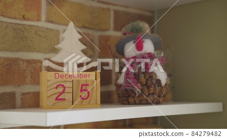 December twenty-fifth, wooden calendar. New Year's Eve. Christmas. Close-up 84279482