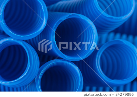 Plastic corrugated pipe for electrical installation close-up Plastic corrugated pipe for electrical installation close-up 84279896