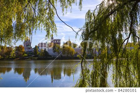 View of the Novodevichy convent (Bogoroditse-Smolensky monastery) and the big Novodevichy pond on a sunny autumn day. Moscow, Russia. UNESCO world heritage site View of the Novodevichy convent (Bogoroditse-Smolensky monastery) and the big Novodevichy pond on a sunny autumn day. Moscow, Russia. UNESCO world heritage site 84280101