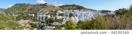 Typical spanish mountain village with its narrow white buildings in Andalusia in summertime 84280169