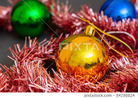 Set of Christmas tree decorations multicolored balls and tinsel Set of Christmas tree decorations multicolored balls and tinsel 84280824