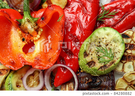 Tasty grilled vegetables on whole background, close up Tasty grilled vegetables on whole background, close up 84280882