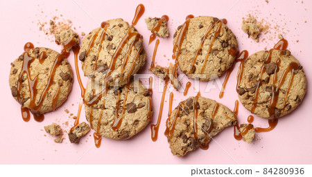 Cookies with caramel on pink background, space for text Cookies with caramel on pink background, space for text 84280936