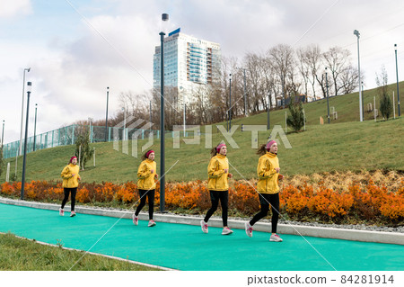 panorama with several images of the same female jogger on a running track against a city background panorama with several images of the same female jogger on a running track against a city background 84281914