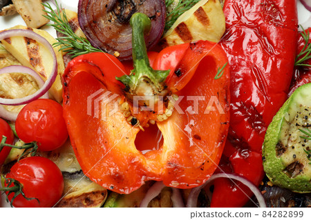 Tasty grilled vegetables on whole background, close up Tasty grilled vegetables on whole background, close up 84282899