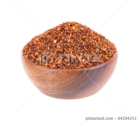 Rooibos red tea in wooden bowl, isolated on white background. Traditional herbal and organic tea. Rooibos red tea in wooden bowl, isolated on white background. Traditional herbal and organic tea. 84284251