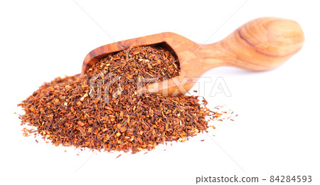 Rooibos red tea in wooden scoop, isolated on white background. Traditional herbal and organic tea. Rooibos red tea in wooden scoop, isolated on white background. Traditional herbal and organic tea. 84284593