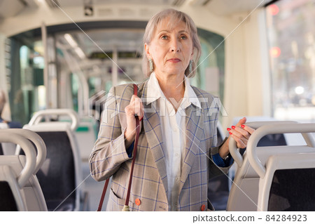 Woman standing in tram 84284923
