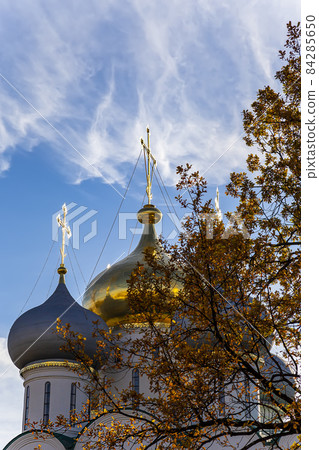 Novodevichy convent (Bogoroditse-Smolensky monastery) on a sunny day. The domes of the Cathedral of Our Lady of Smolensk (16th century). Moscow, Russia. UNESCO world heritage site Novodevichy convent (Bogoroditse-Smolensky monastery) on a sunny day. The domes of the Cathedral of Our Lady of Smolensk (16th century). Moscow, Russia. UNESCO world heritage site 84285650