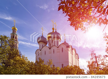 Novodevichy convent (Bogoroditse-Smolensky monastery) on a sunny autumn day. Cathedral of Our Lady of Smolensk (16th century). Moscow, Russia. UNESCO world heritage site 84285673