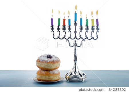 Jewish holiday Hanukkah background with Menorah- traditional candelabra, spinning top Dreidel and Doughnut onwhite background 84285802