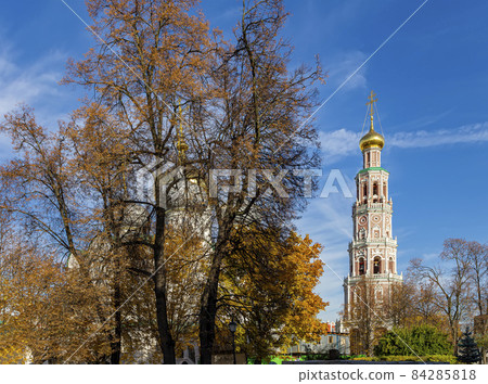 Novodevichy convent (Bogoroditse-Smolensky monastery) on a sunny autumn day. Octagonal bell-tower. Moscow, Russia. UNESCO world heritage site Novodevichy convent (Bogoroditse-Smolensky monastery) on a sunny autumn day. Octagonal bell-tower. Moscow, Russia. UNESCO world heritage site 84285818