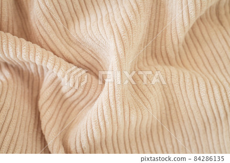 Ribbed beige corduroy or velvet texture background 84286135
