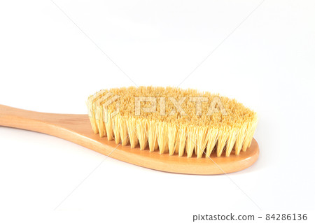Dry anti cellulite massage brush isolated on white background Dry anti cellulite massage brush isolated on white background 84286136