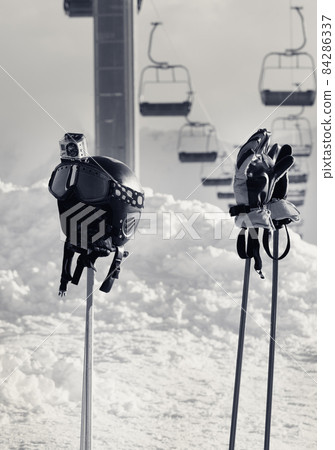 Protective sports equipment on ski poles. Black and white. Protective sports equipment on ski poles. Black and white. 84286337