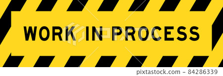 Yellow and black color with line striped label banner with word work in process Yellow and black color with line striped label banner with word work in process 84286339